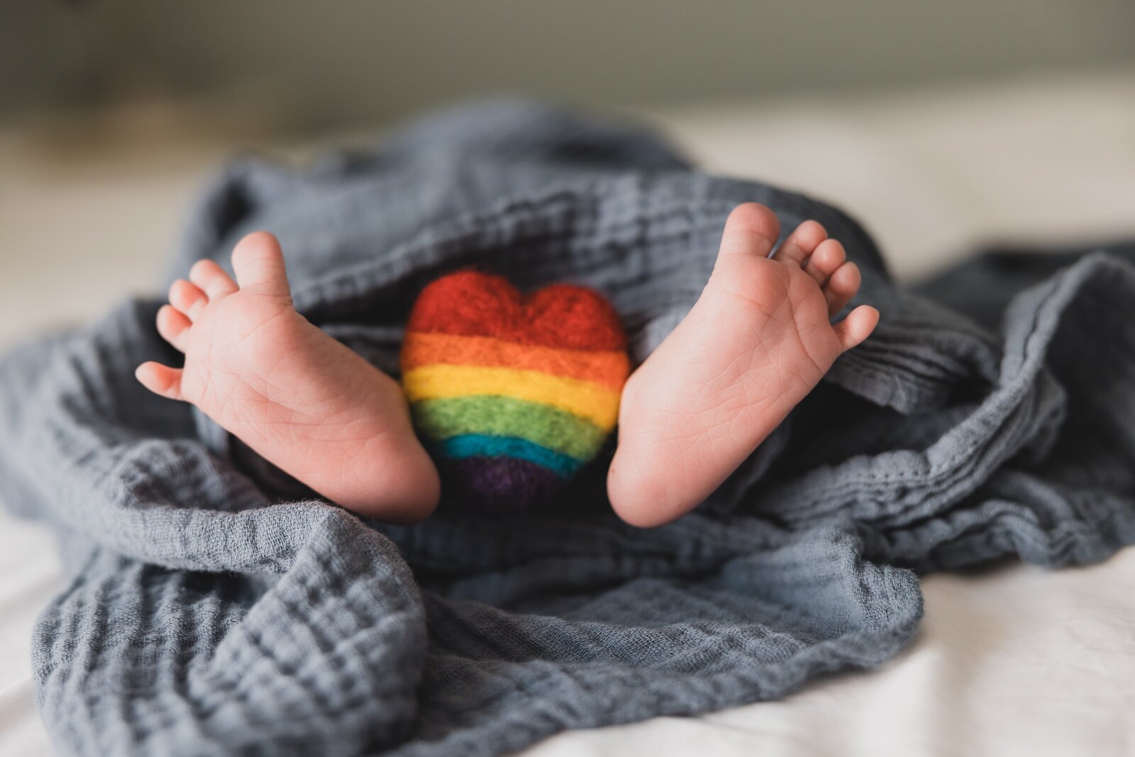 Rainbow baby newborn pose  during Pensacola  newborn photography session