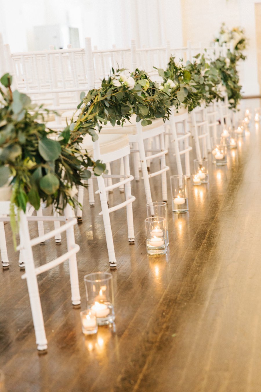 Modern & clean indoor wedding ceremony aisle decor at Belle Mer in Newport, RI