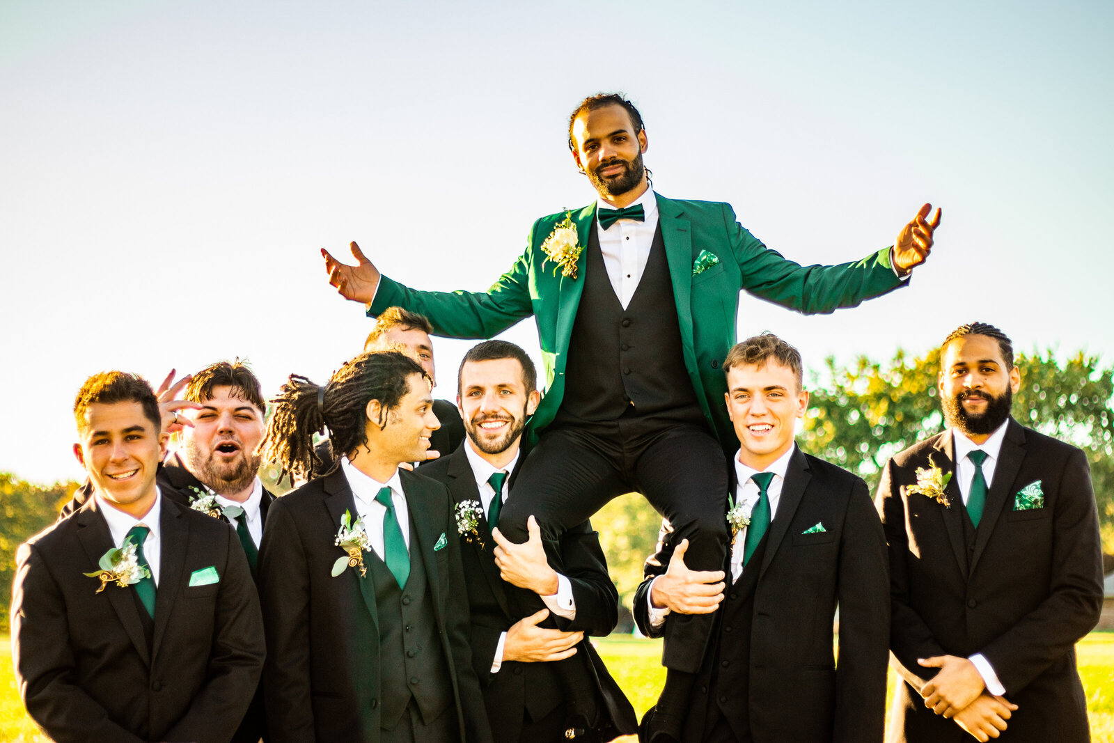 Groom and groomsmen fun photos at sunset. Photo by Devin Ramon Photography.