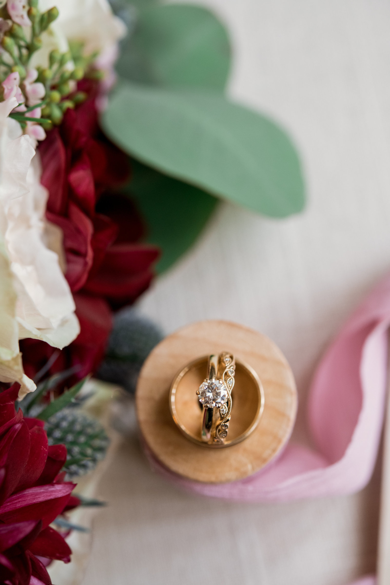creative photos of wedding rings at Coindre Hall