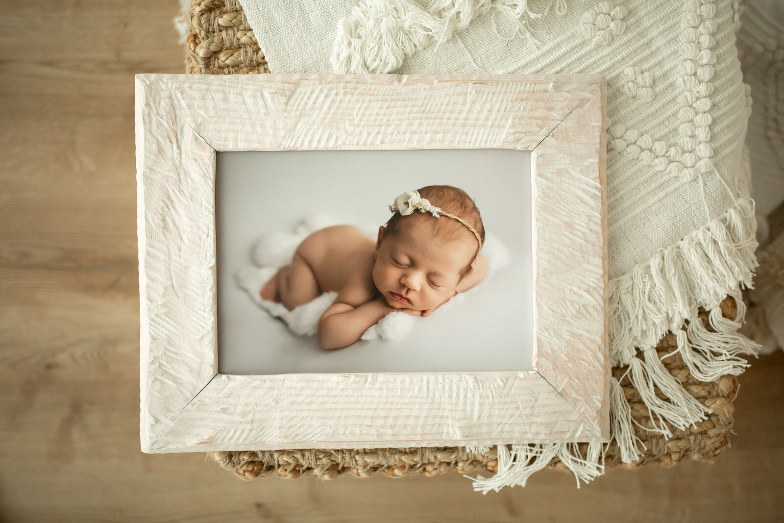 sleeping newborn photo in boho white frame