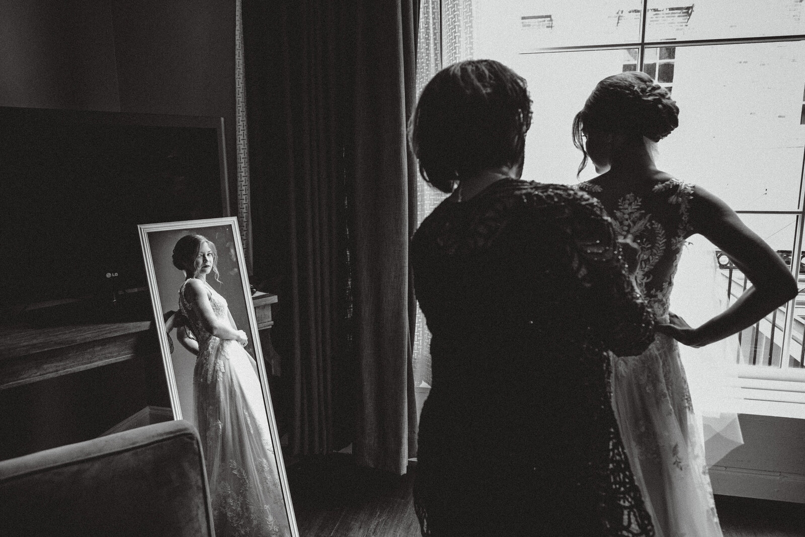 Bride by window with mirror