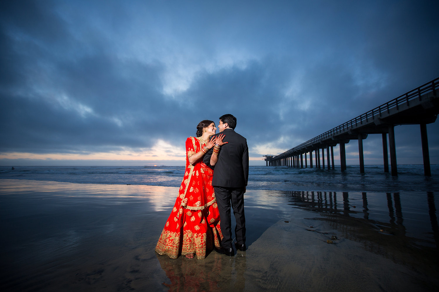 Sunset Wedding Portrait at Scripps Pier of Bright Hindu Couple