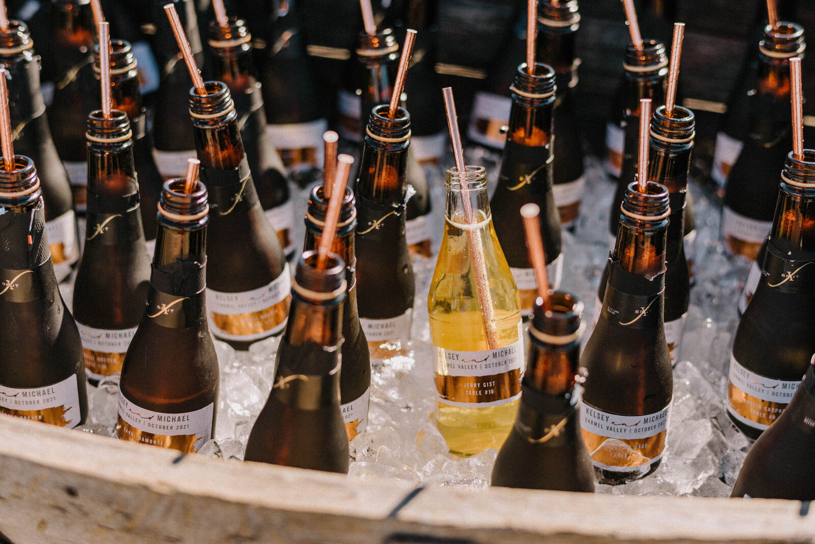 Mini bottles of champagne as escort cards at a wedding