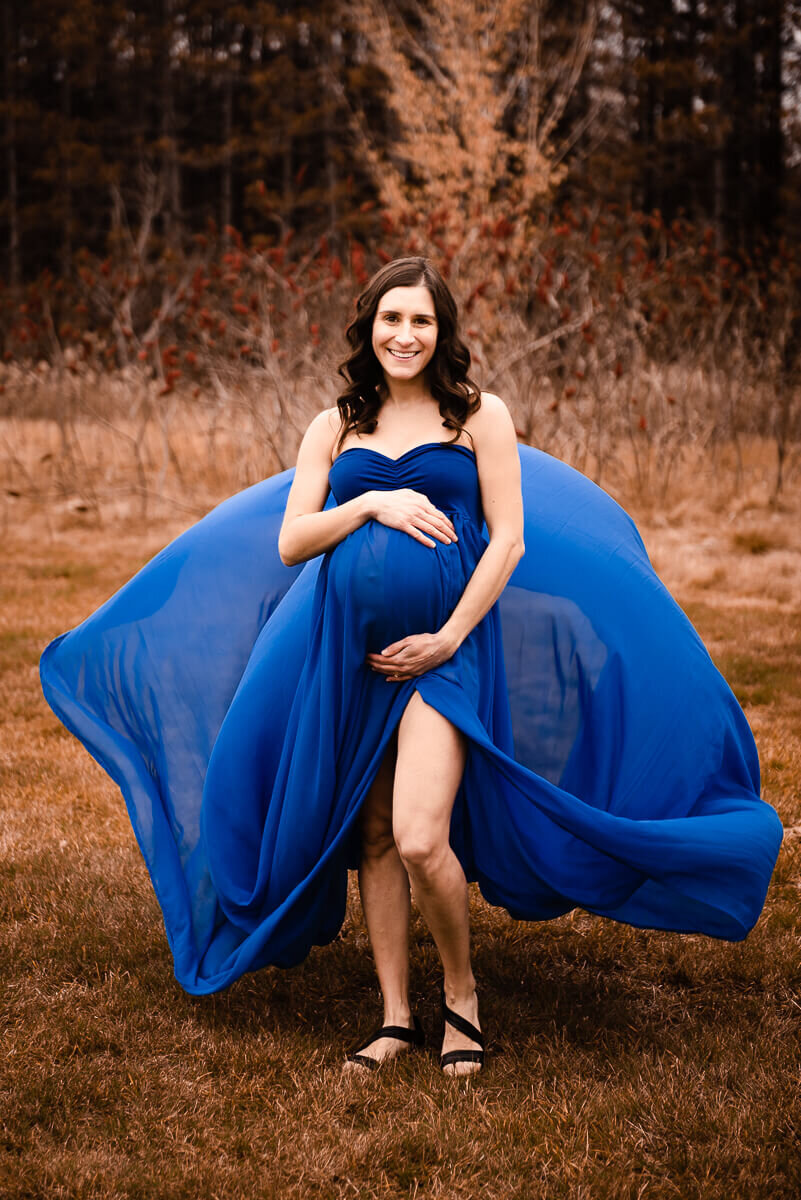 Wind blows gown train for Toronto maternity photo