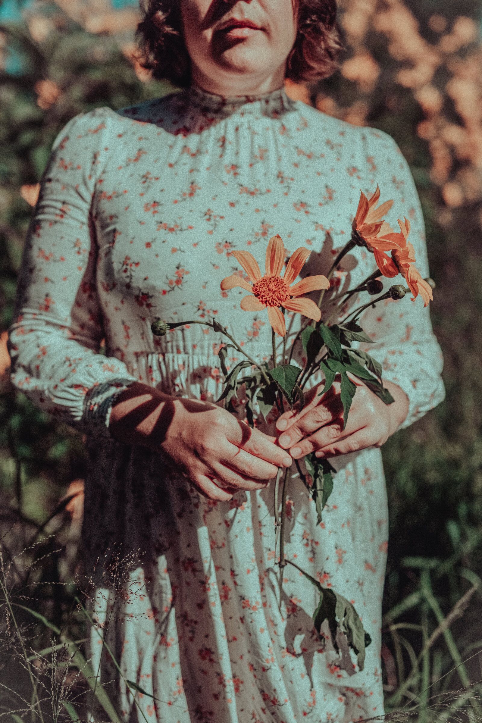 Personal branding photograph featuring woman and floral decor