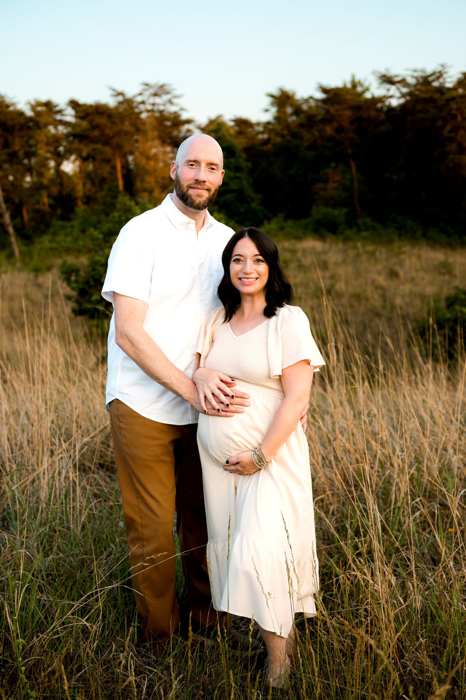 expecting parents having a maternity photo session