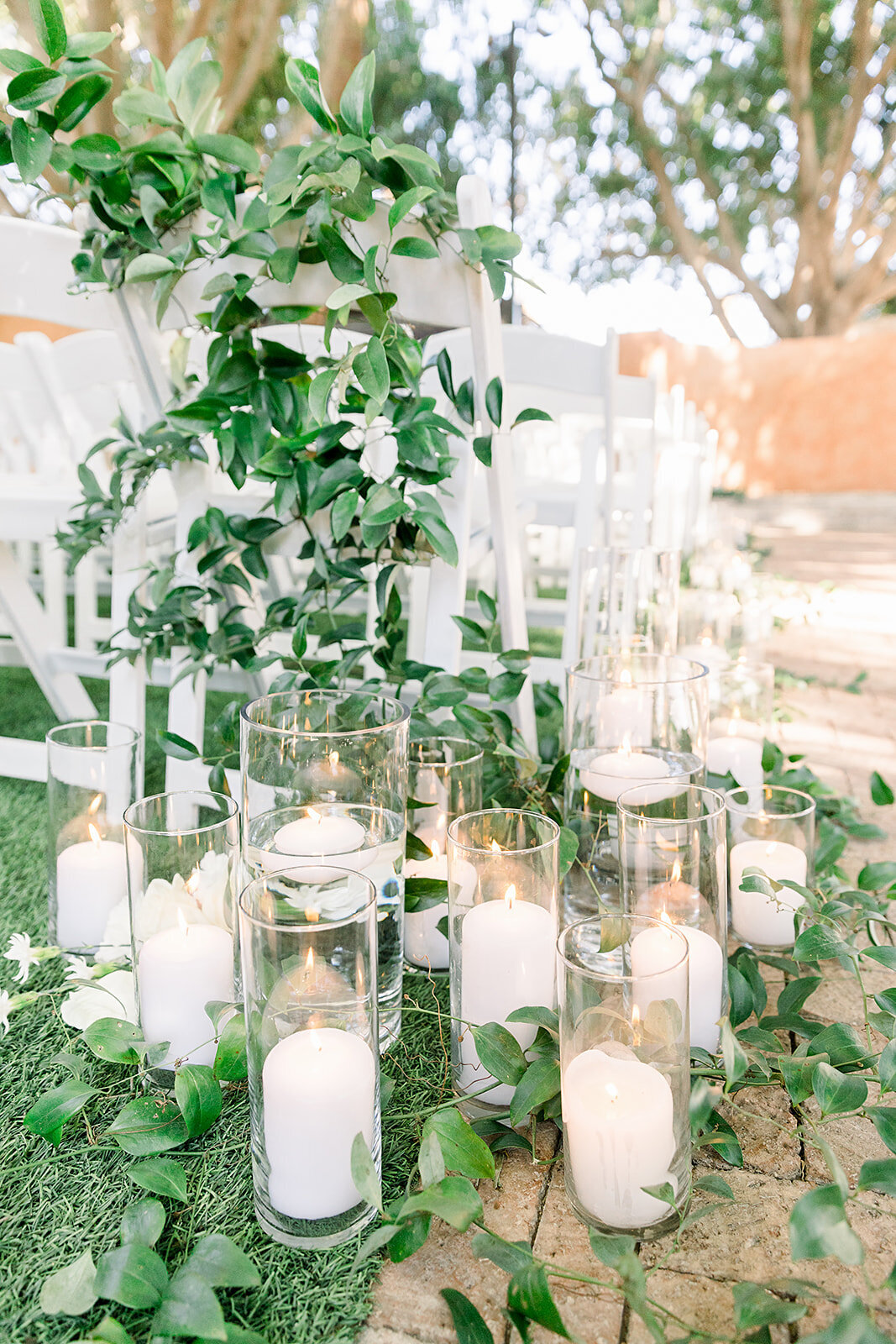 weddings-phoenix-wedding-ceremony-pillar-candles-greenery