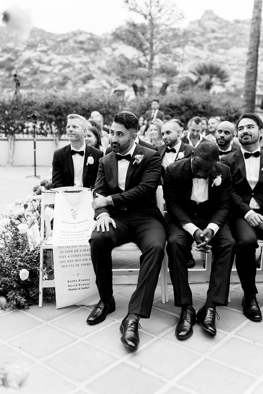 Editorial black and white film image of bridal party posing with laughter and joy at Hummingbird Nest Ranch.