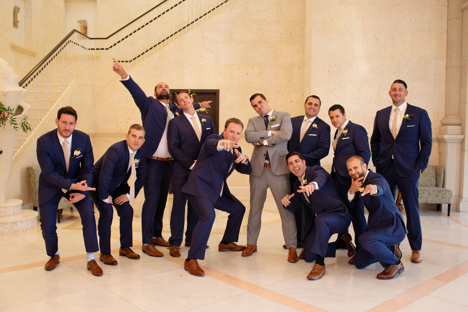 Groom and groomsmen posing at Atlantis Banquet and Events