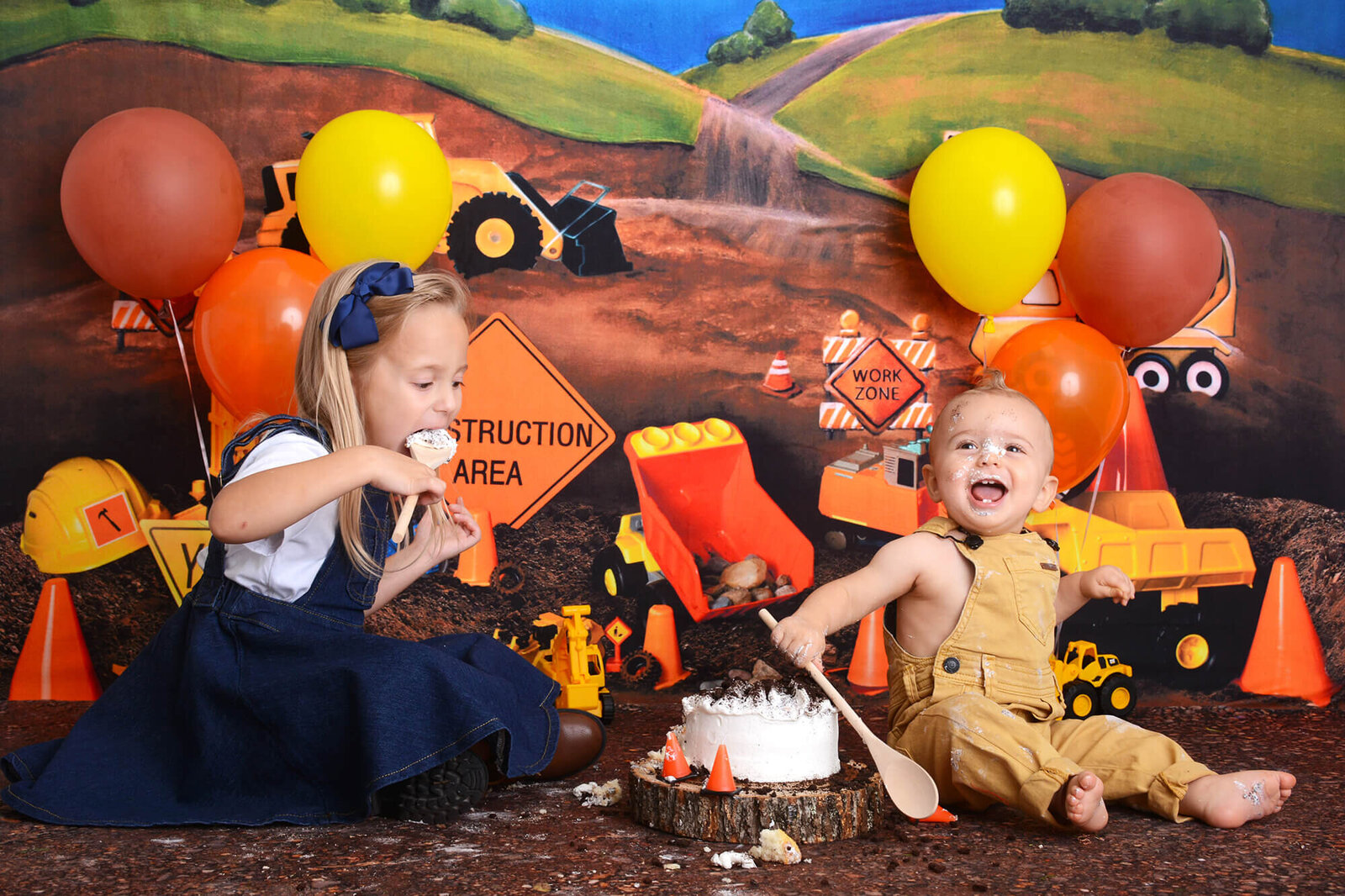 kids smile with smashing a cake at a photo studio in houston