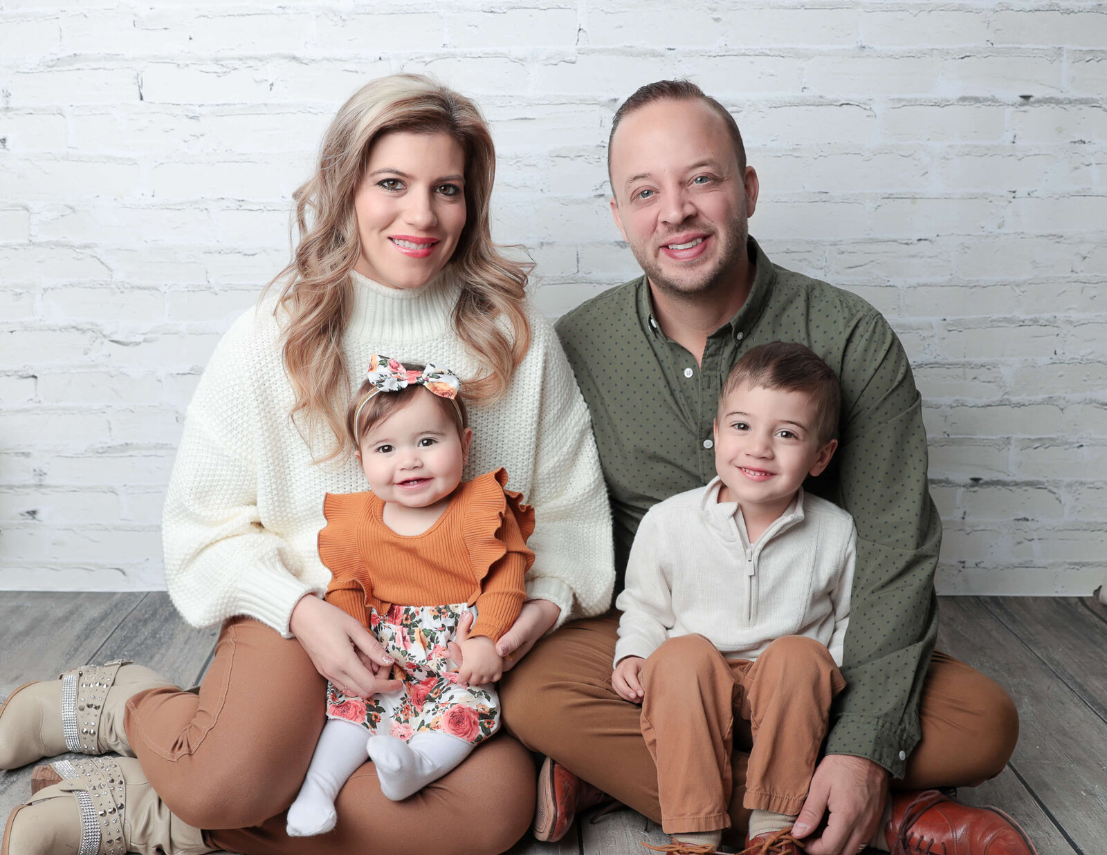 Family posed at our studio in Rochester, Ny.