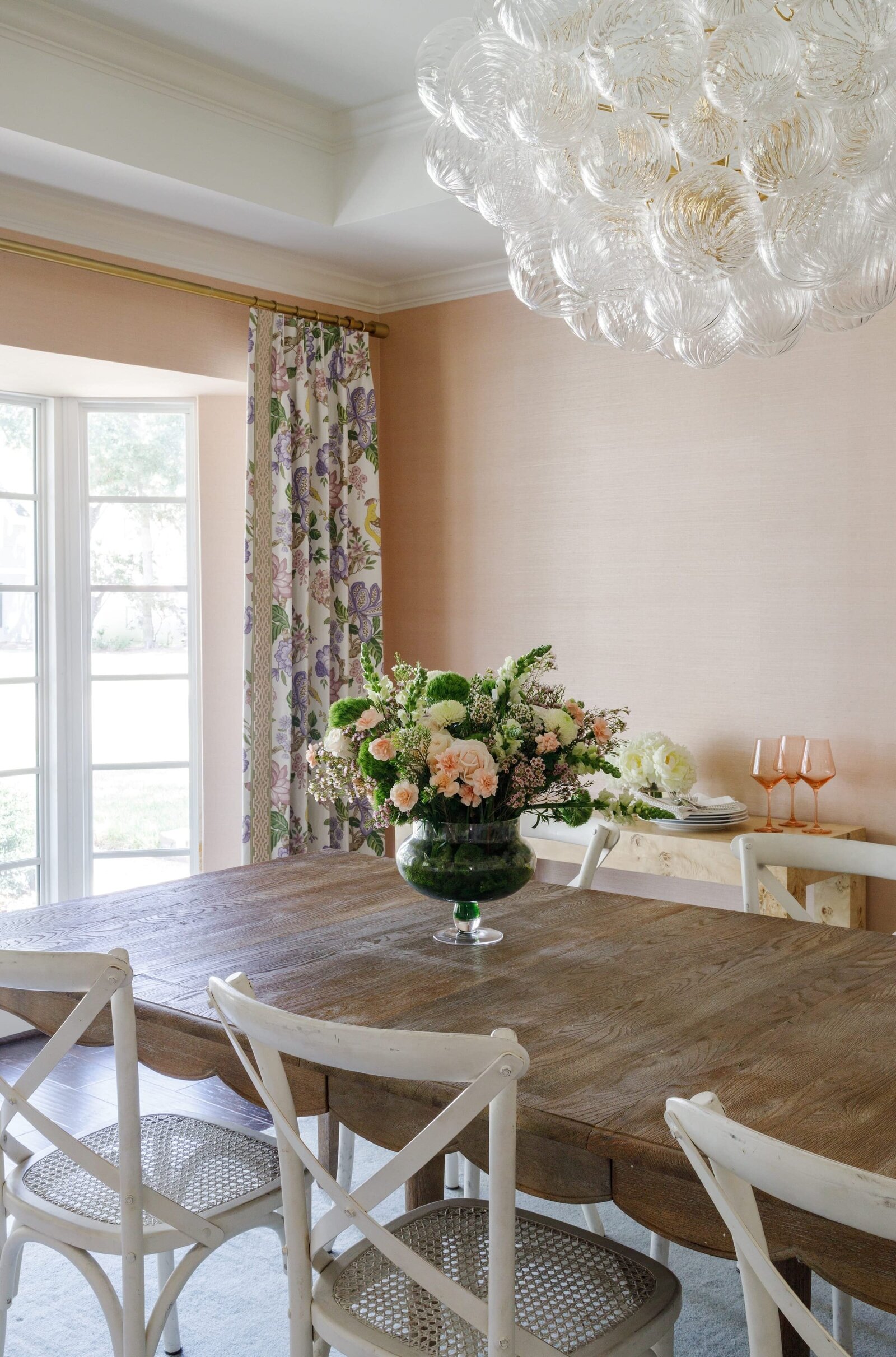 vision and hammer dining room with pink walls abd wooden table