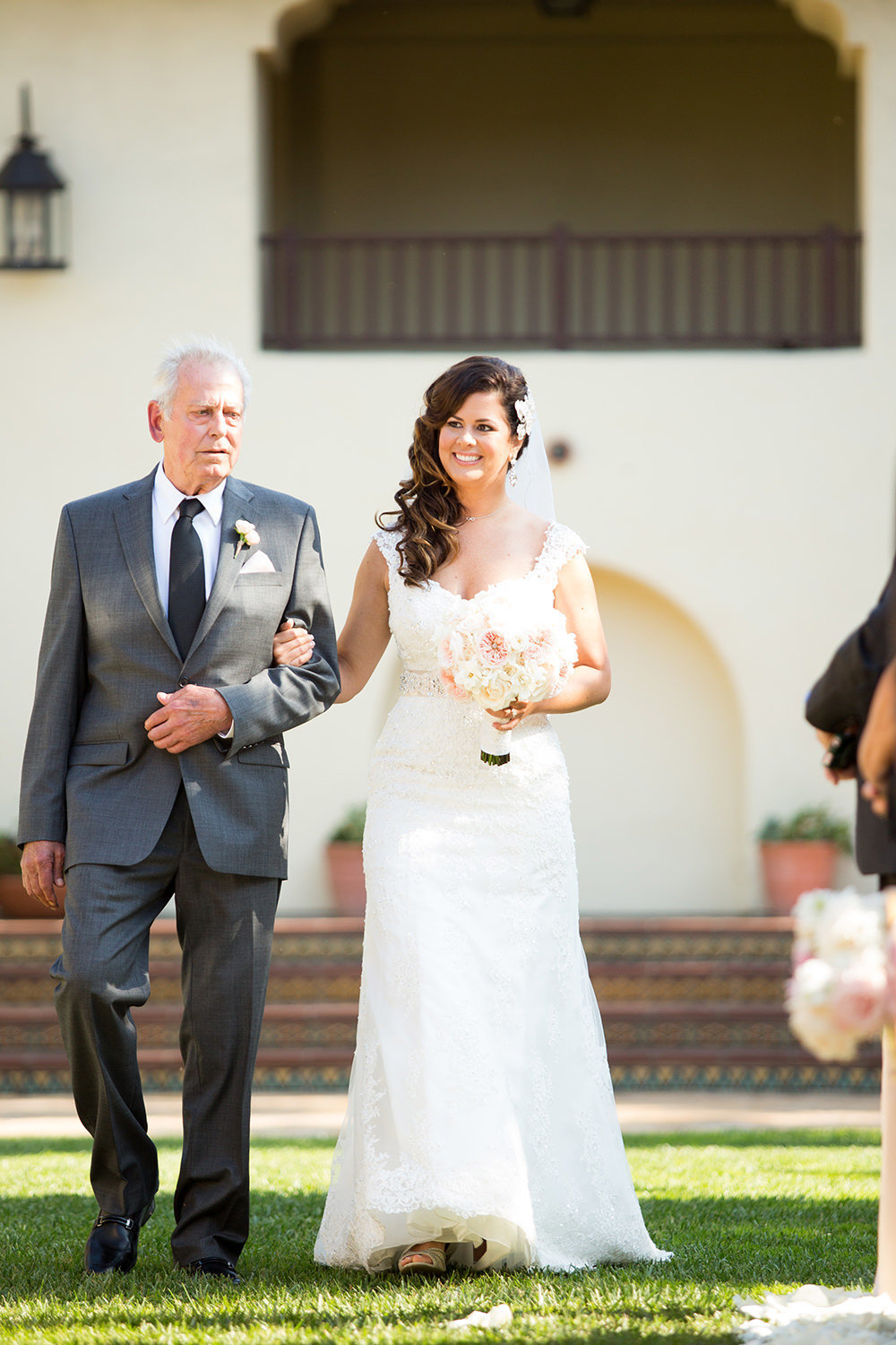 A bride and her father walk the aisle