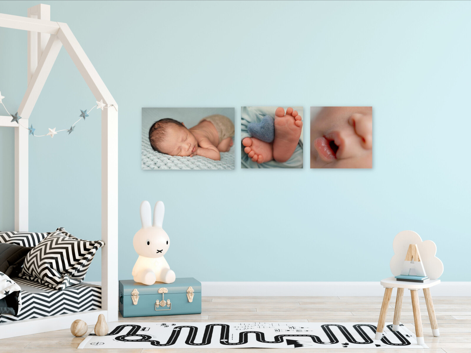 Newborn baby pictures hanging in a client's home