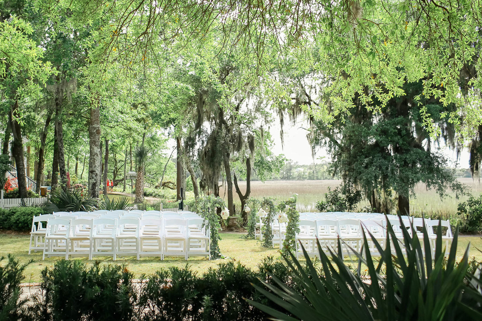 Vine and white flowers adorn the aisle, I'ON Creek Club, Charleston Wedding Photography.