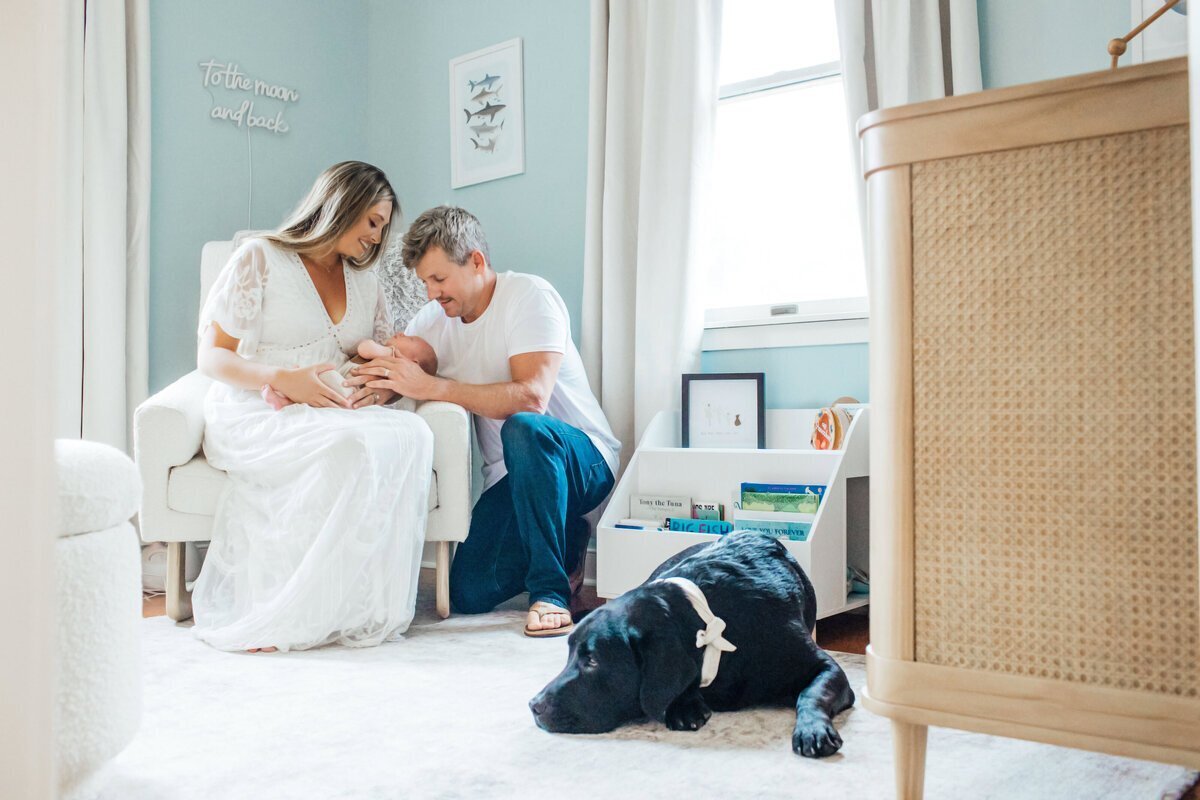 newborn photography nj of family with newborn in nursery