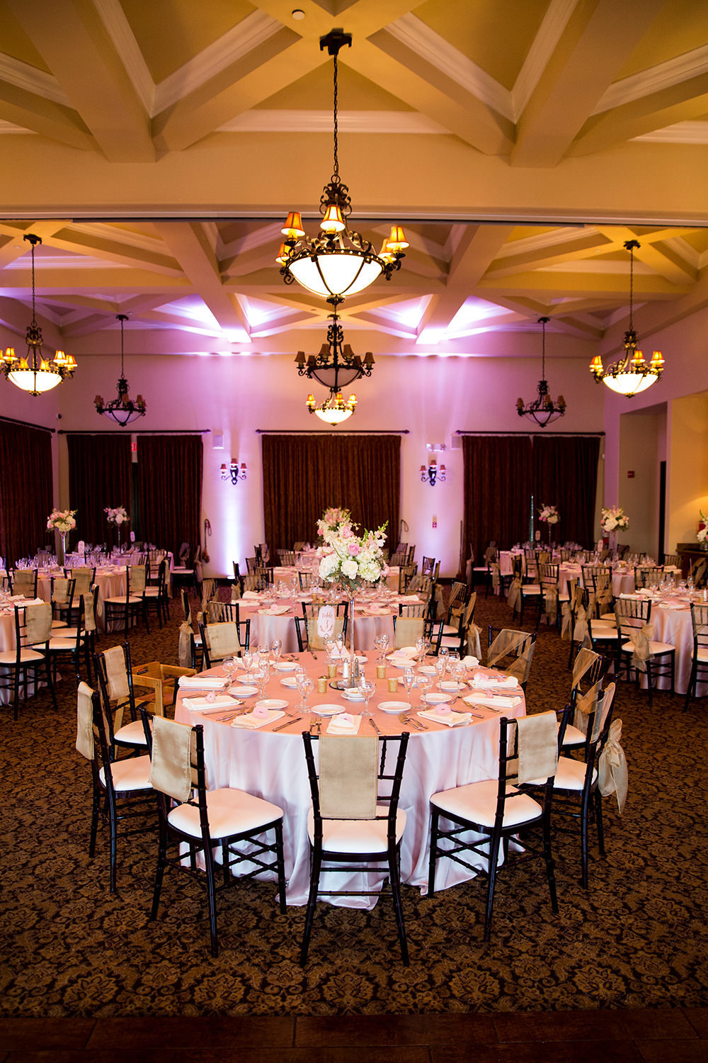 reception space at wedgewood purple pink uplighting