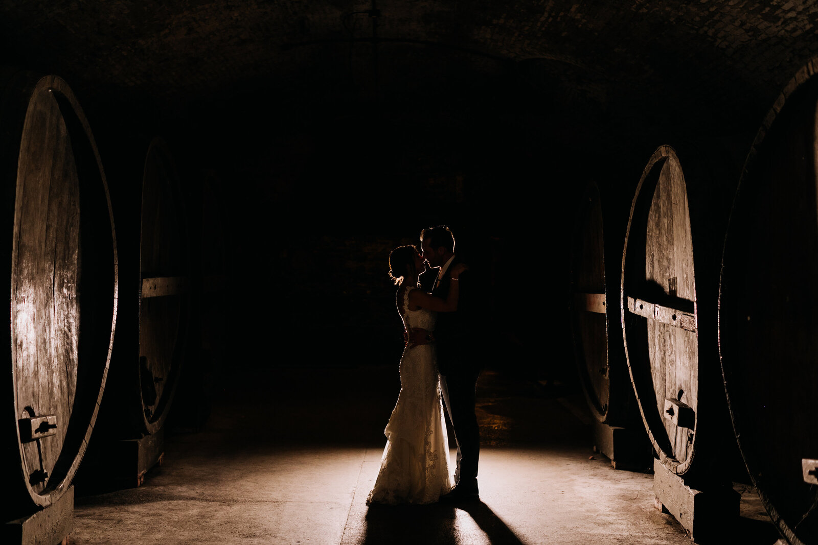 bride and groom wine barrels