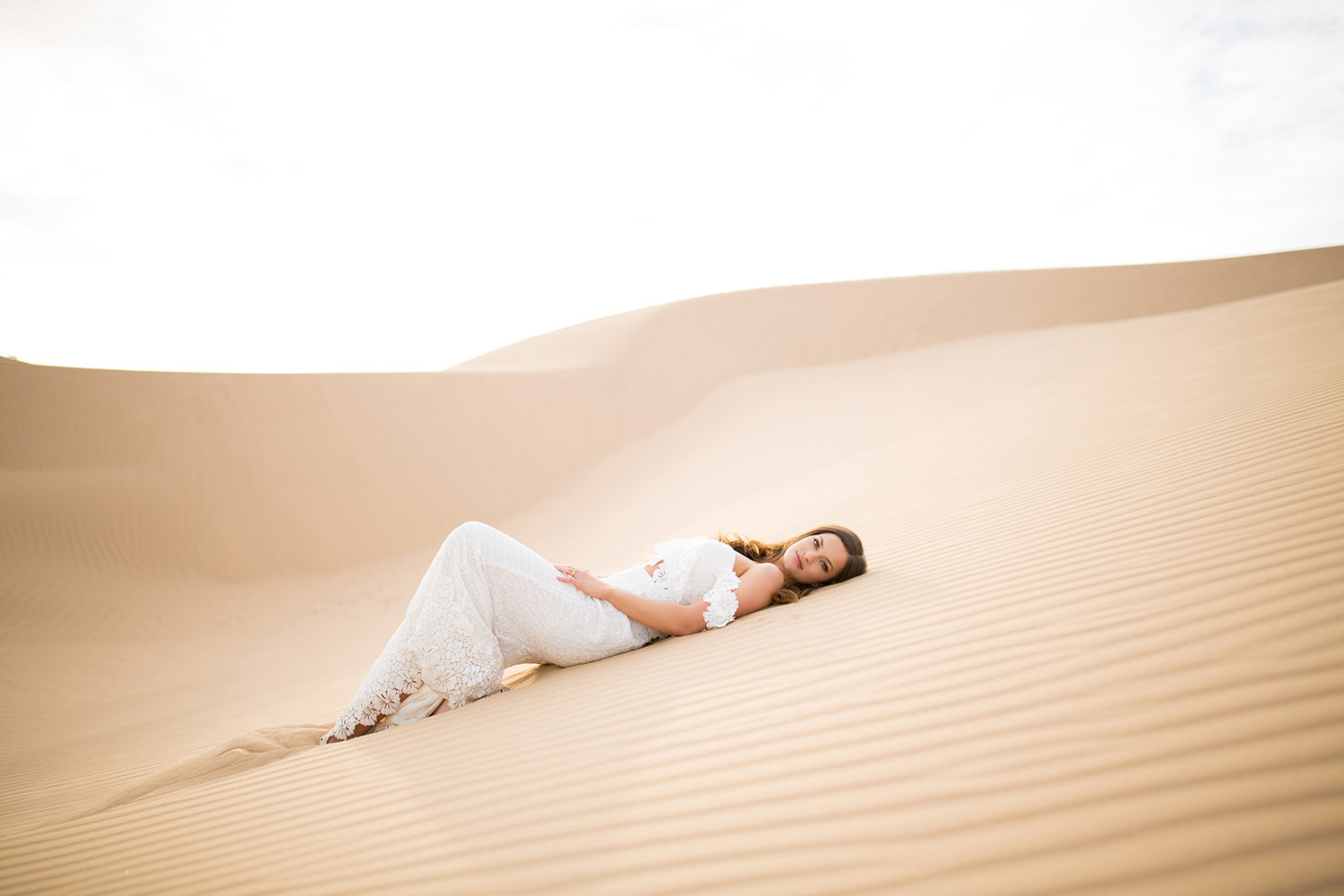 Lovely Bride Laying Down on Glamis Sand Dune During her Wedding