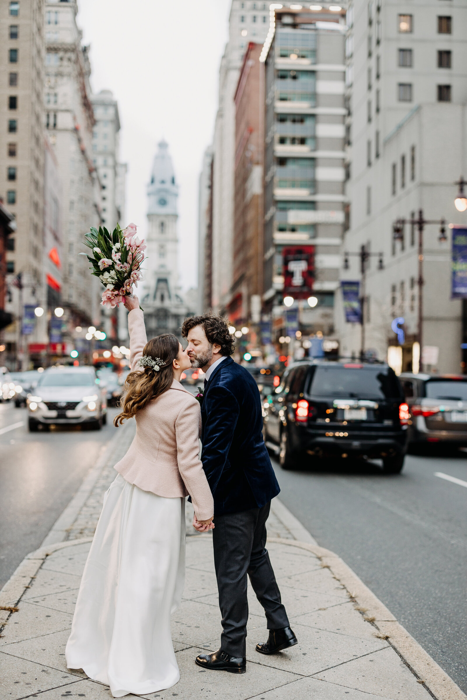 bride and groom kissing broad street