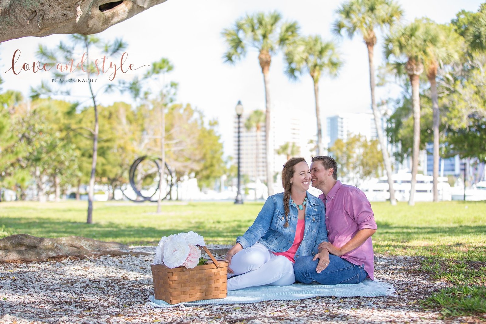Sarasota Engagement Photography of couple having a picnic  under a tree at  Bayfront Park