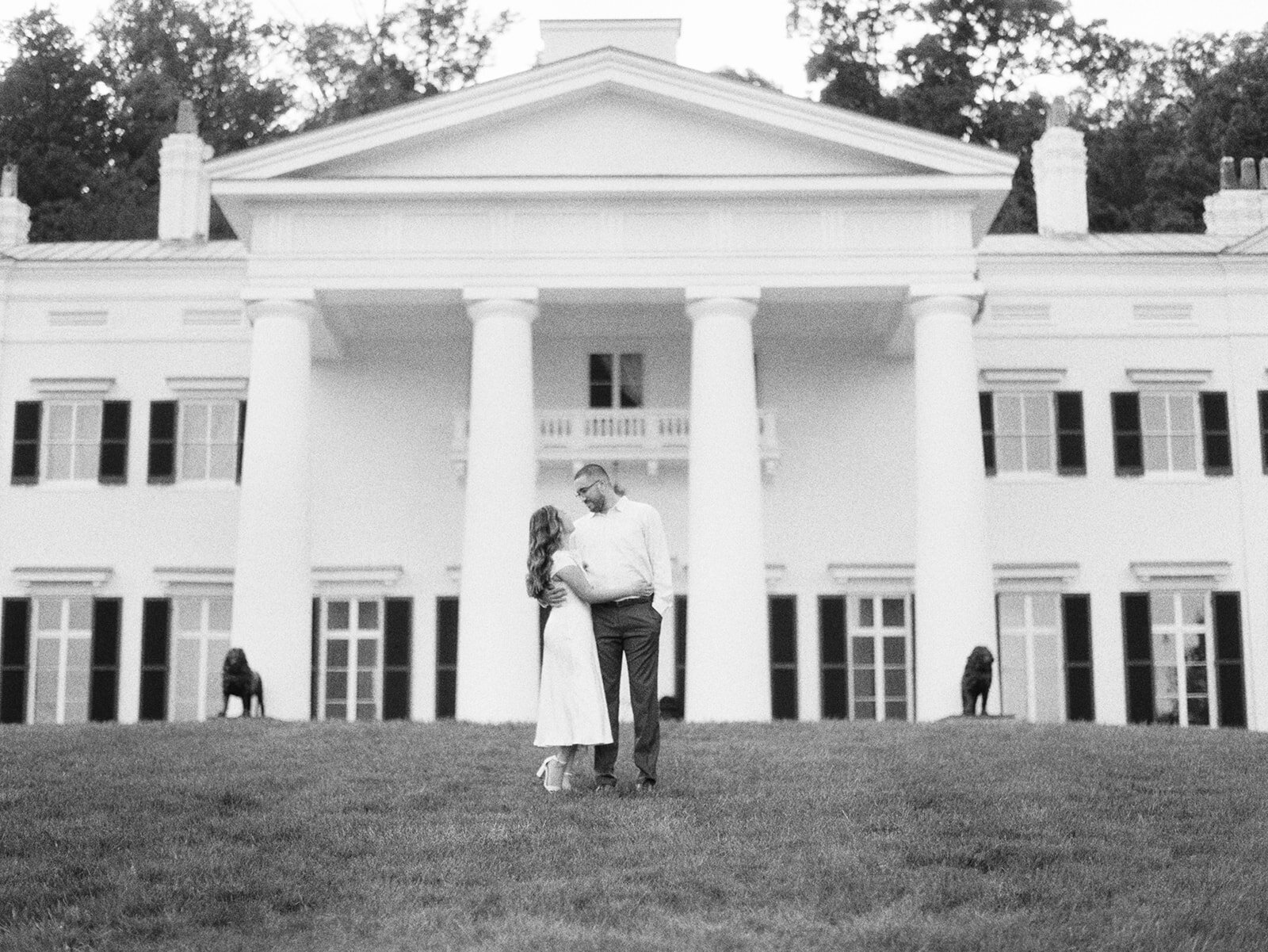 A couple on the lawn at mortgage hall shot on black and white film