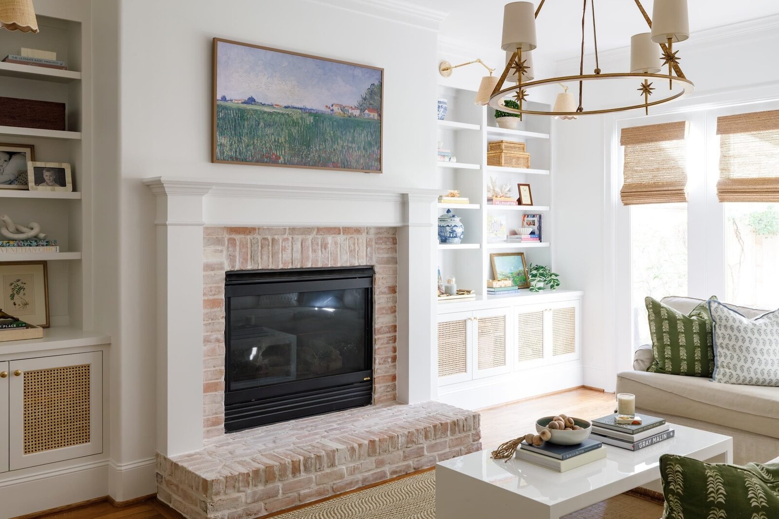 vision and hammer living room with brick fireplace and styled shelves
