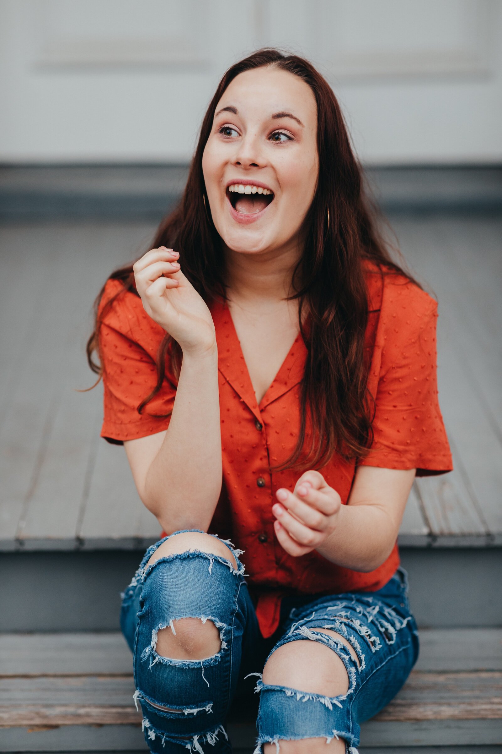 High school senior girl laughing during photo session
