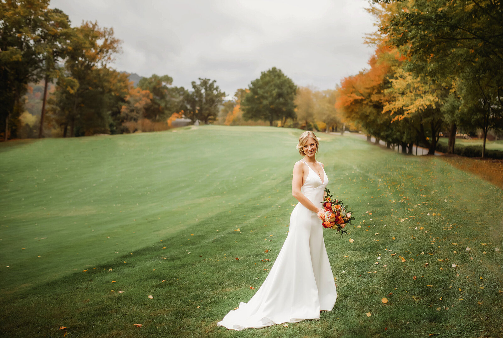 Bride poses for Bridal Portraits at Asheville Country Club  in Asheville, NC.