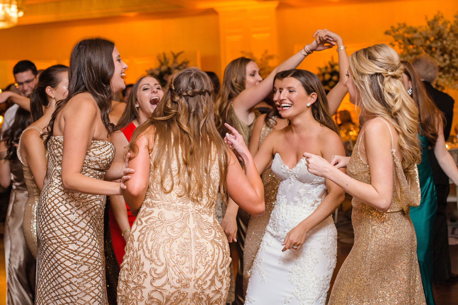 bride and bridesmaids dancing at Glen Head Country Club