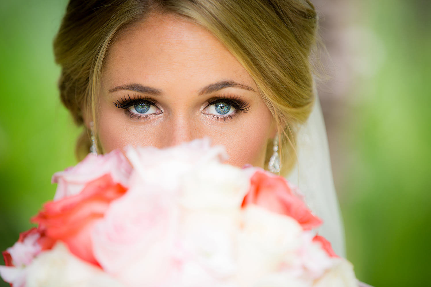 close up of bride with bouquet at ocean view room