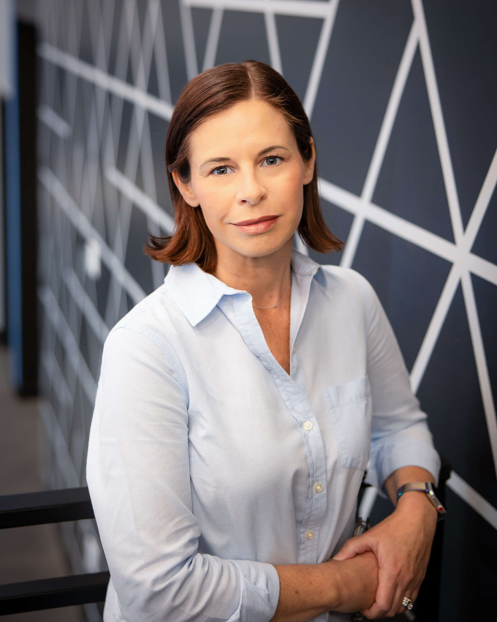 Personal branding photoshoot for an entrepreneur in Orlando, Florida. Office setting showcasing a confident individual engaged in work, reflecting leadership and innovation.