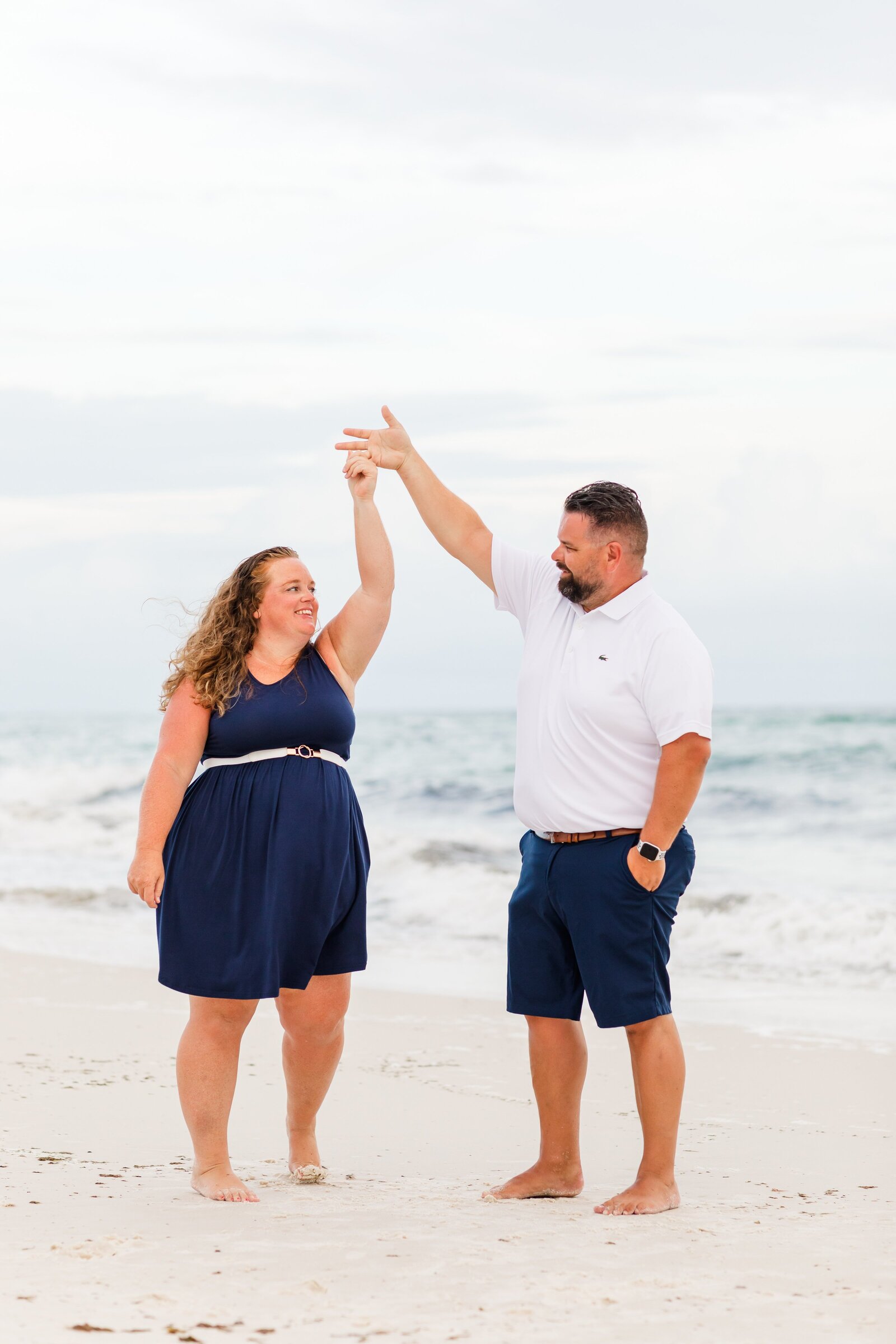 Couple dancing on the beach during photo session on Pensacola Beach