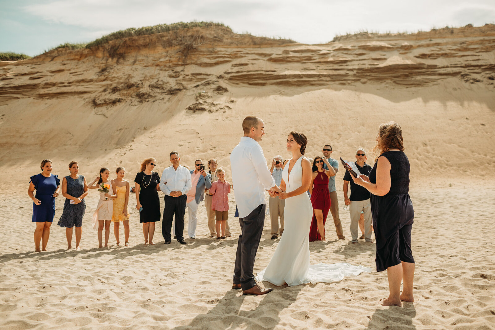 couple elopes on a beach in massachusetts with friends