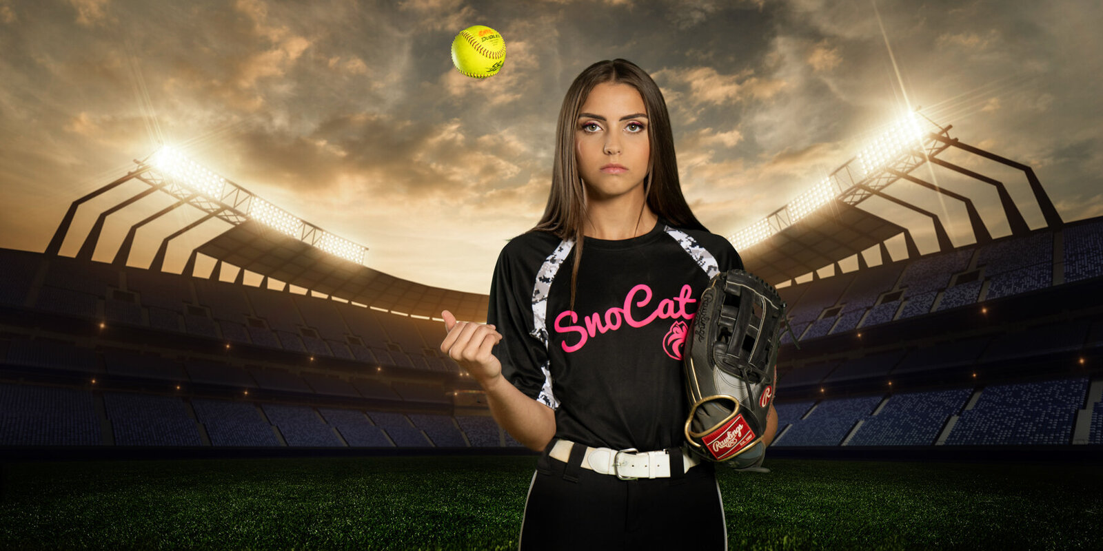 Blaine Minnesota high school senior picture of girl with softball in stadium