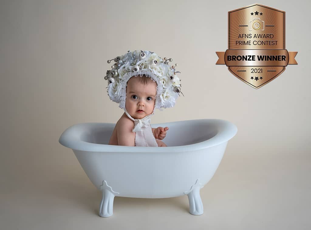 baby sitting in tub