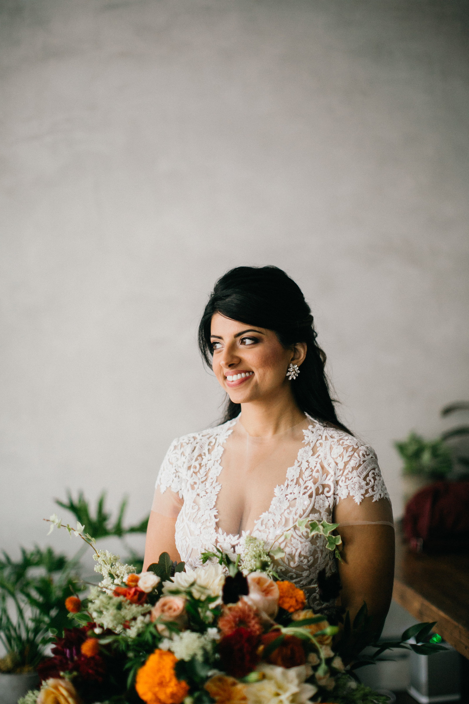 Radiant bride photographed with her big and beautiful floral bouquet in Lokal Hotel.