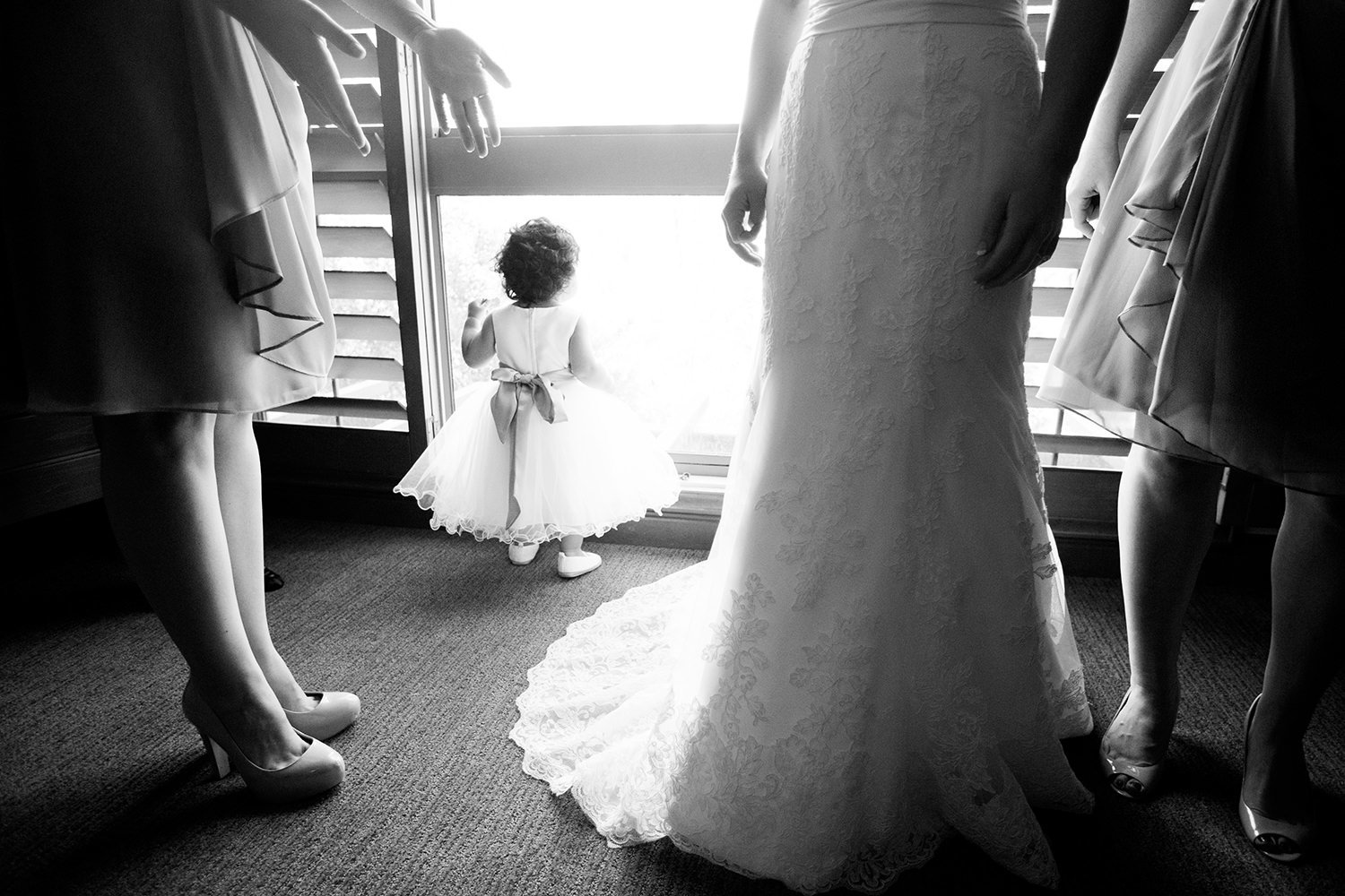 flower girl looking out the window