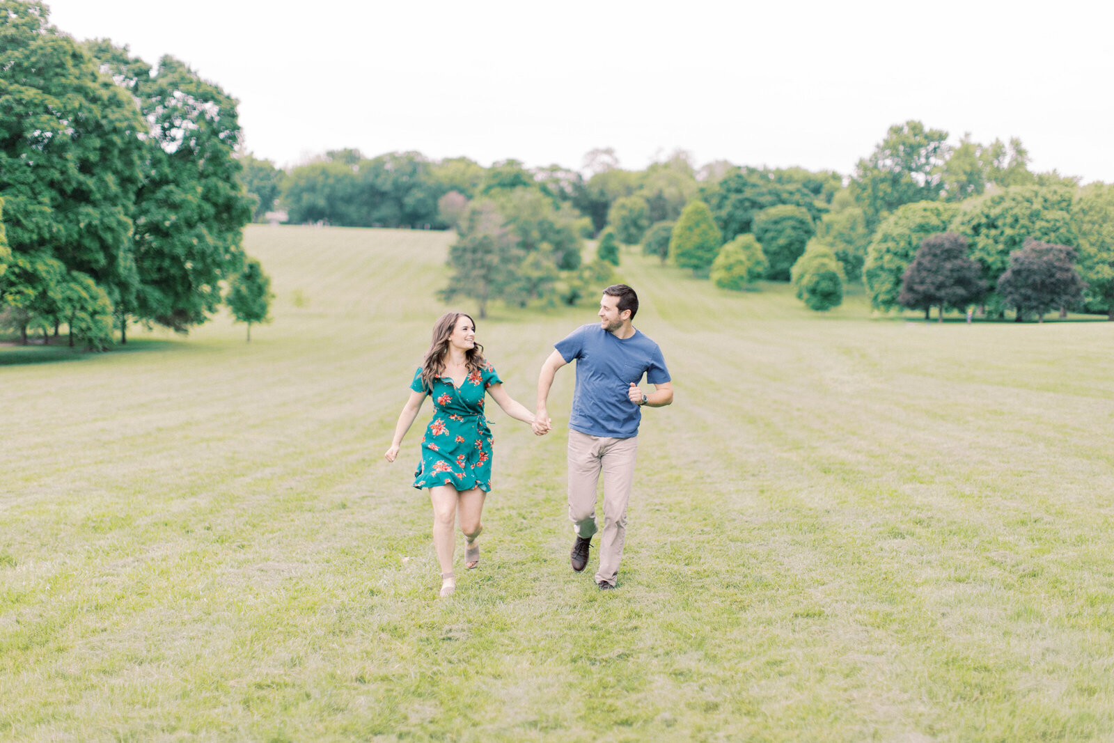 Couple runs through Loose Park for engagement photos kansas city