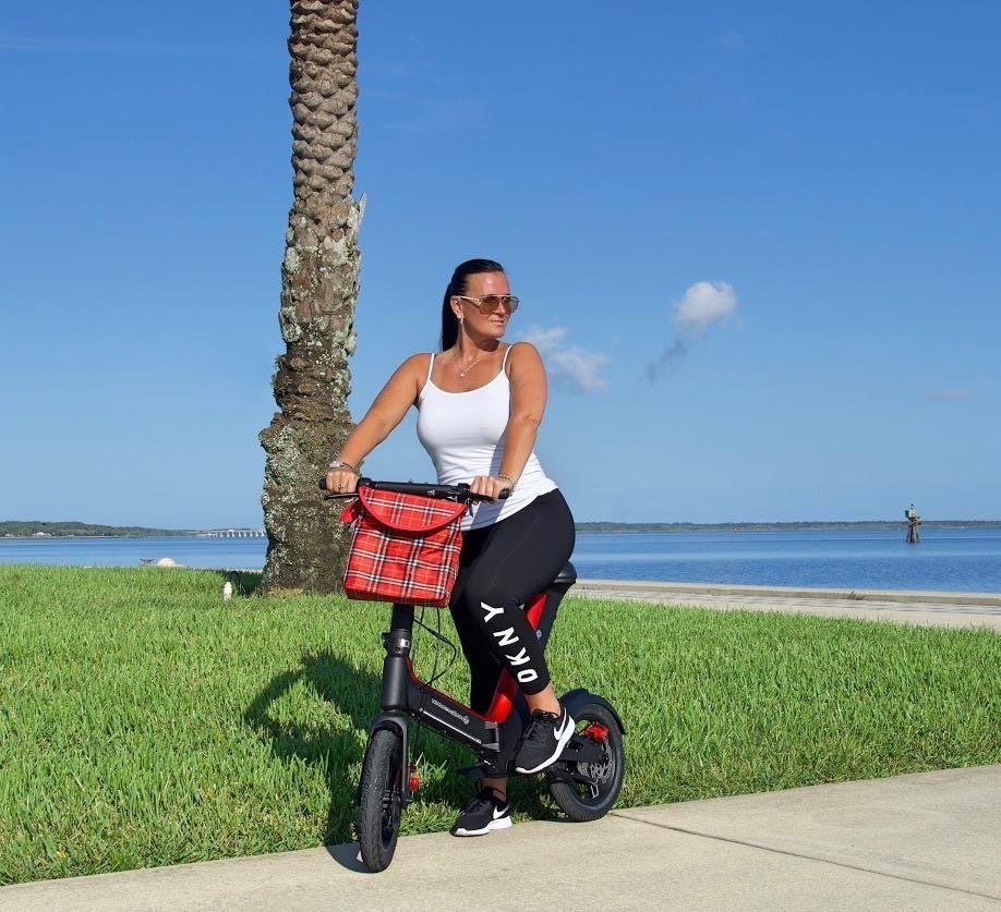 Lady riding Red Go-Bike M3 at the beach; V&D Electric Bikes