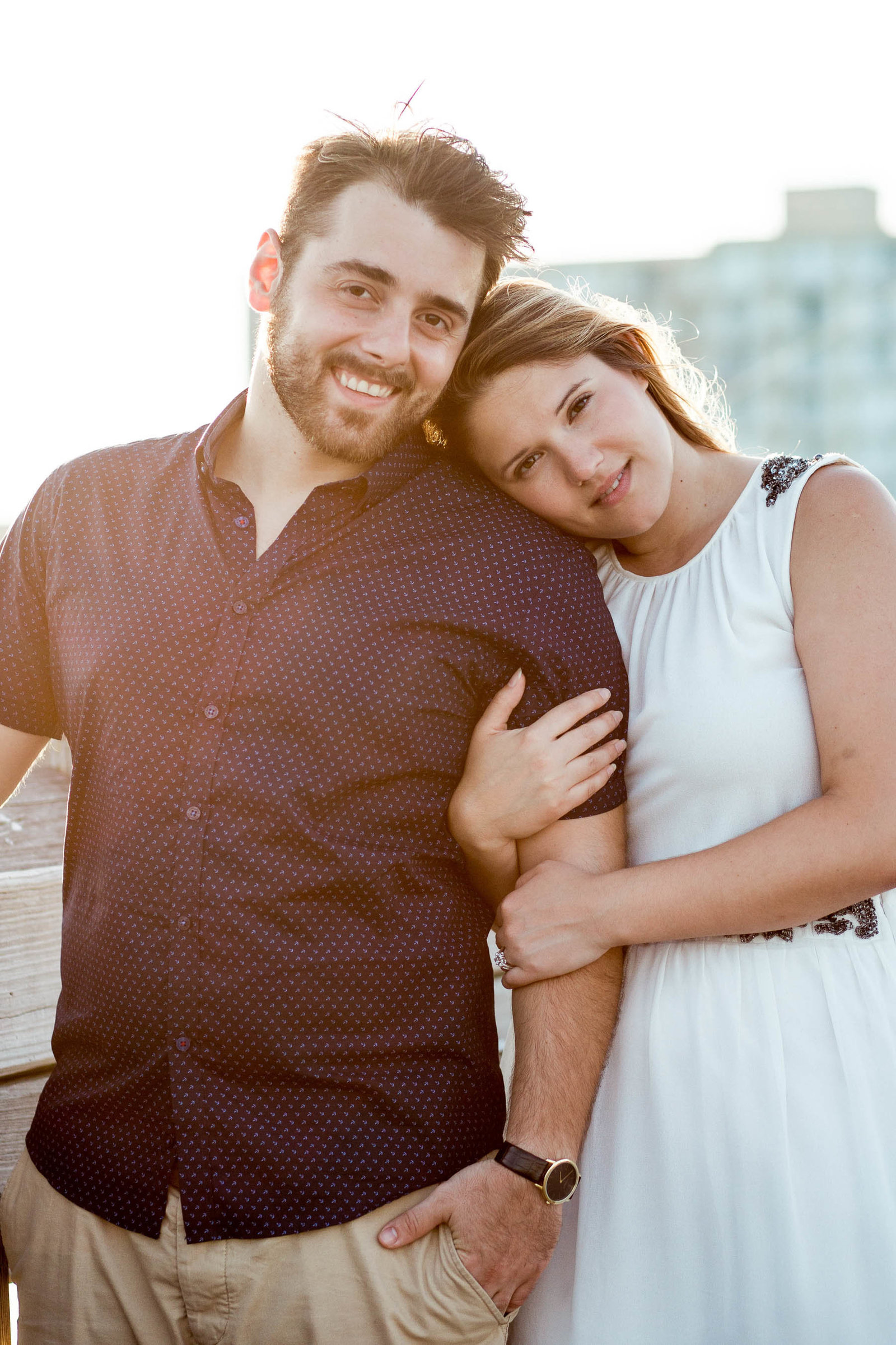 Engaged Couple on fishing pier, Folly beach, Charleston engagement photography.