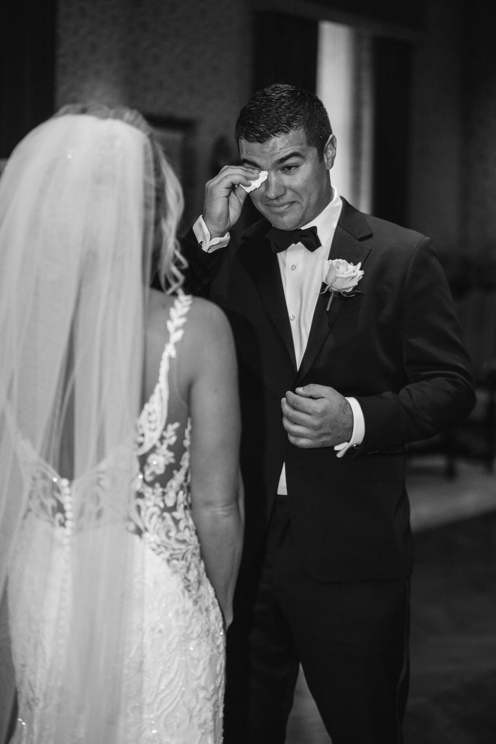 groom crying after seeing his bride for the first time