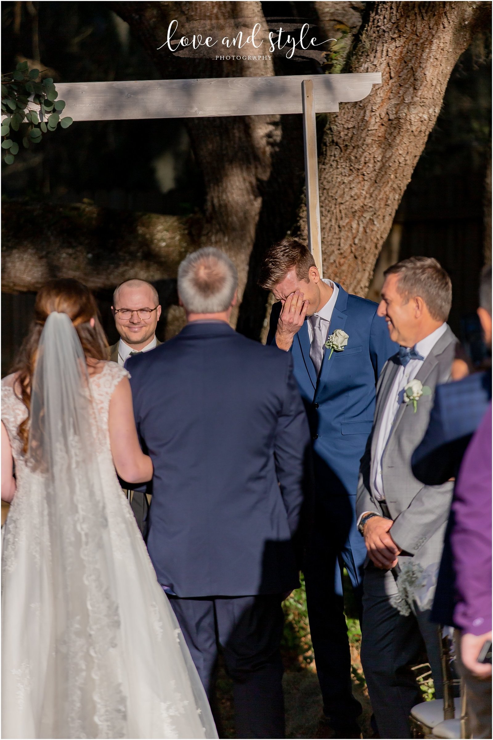 Groom sees his bride walking down the aisle at The Barn at Chapel Creek in Venice, Florida