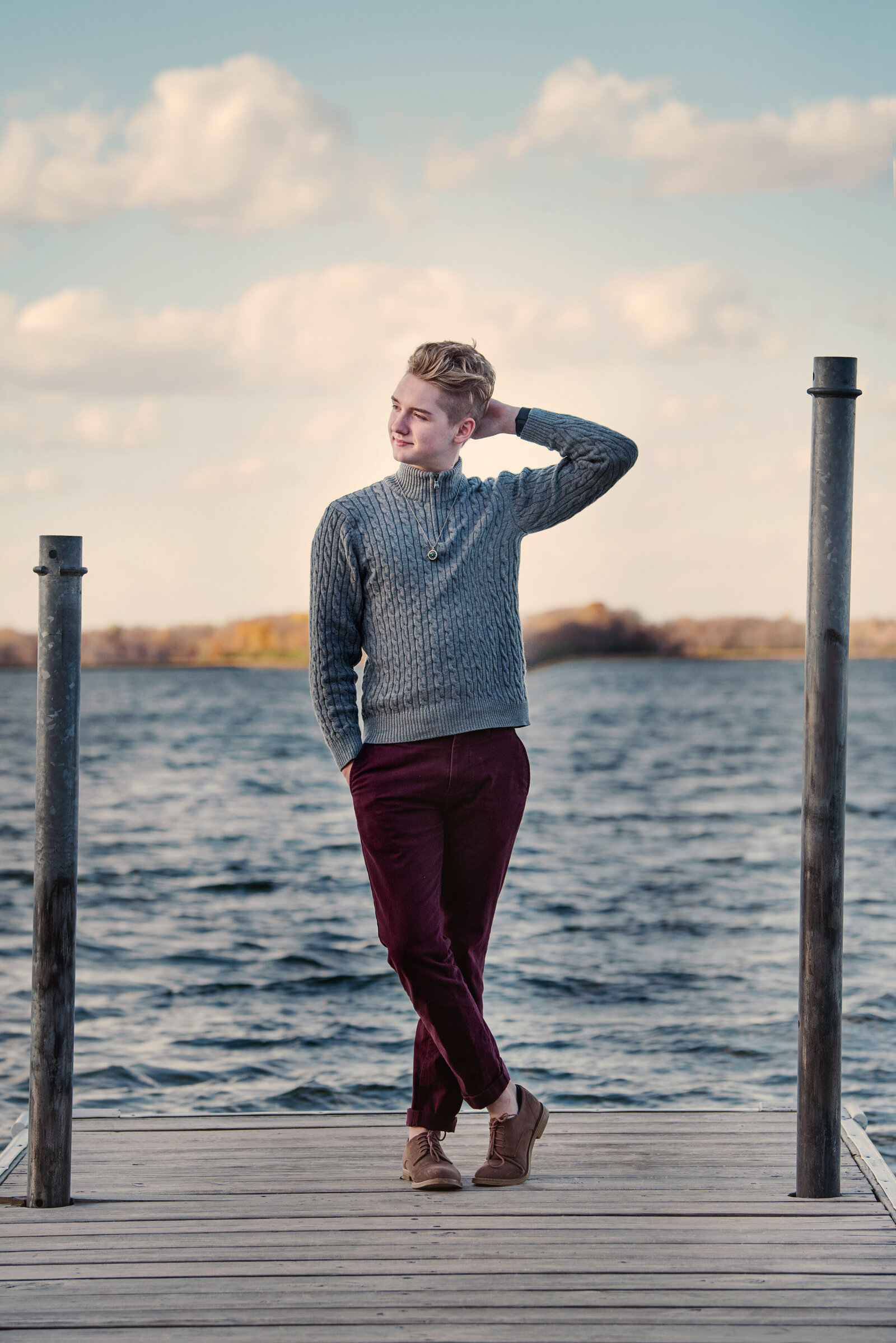 Mound Minnesota high school senior boy on the dock wearing a casual outfit