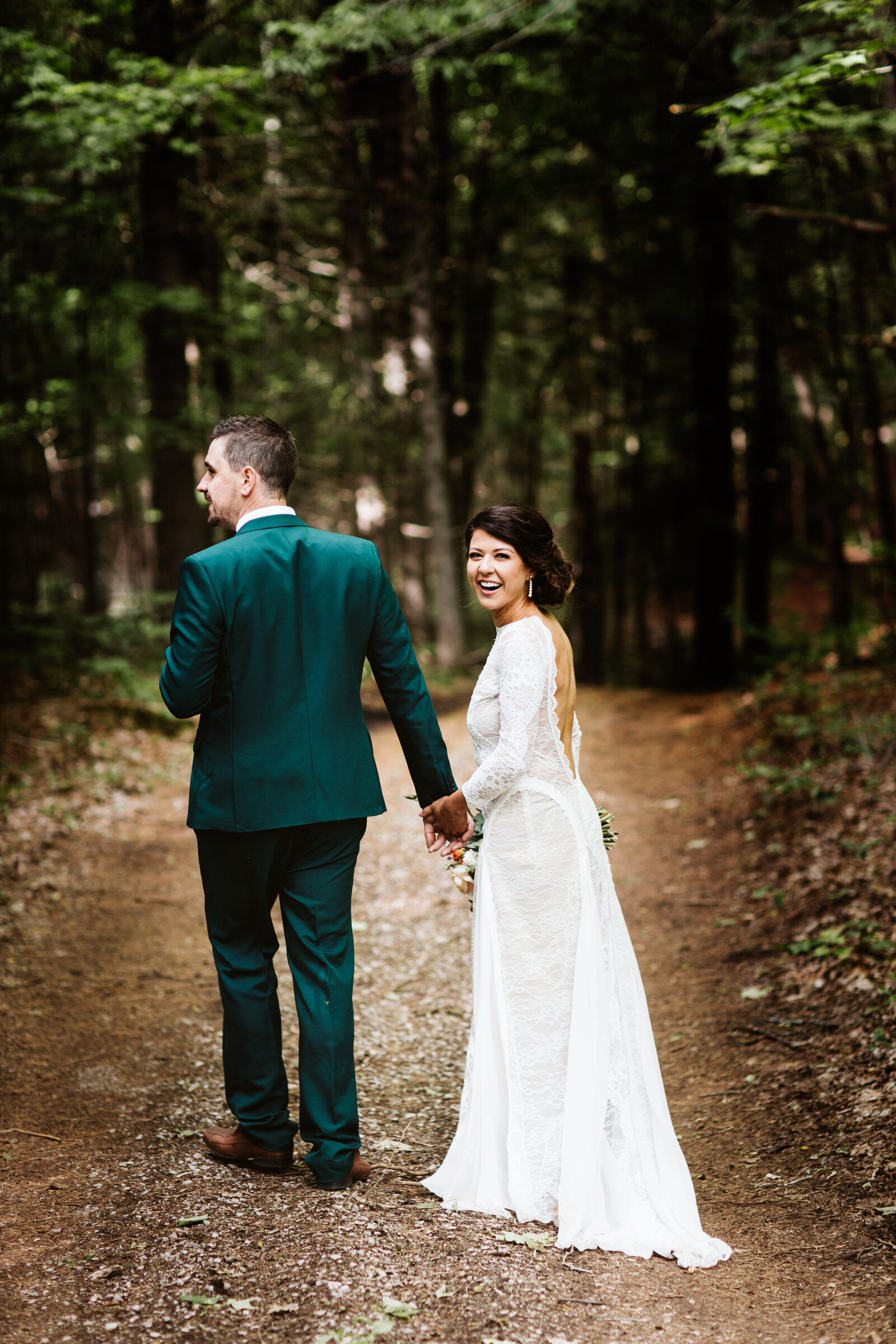 kawartha lakes photographer mary zita payne capturing bride and groom in wood in bancroft