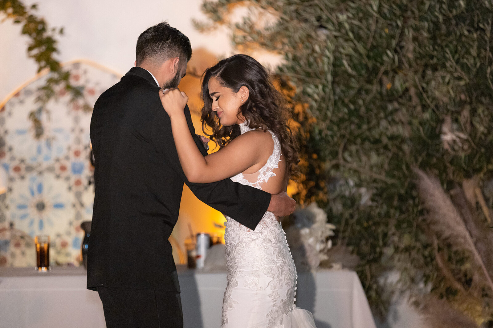 Beautiful bride crying during father daughter dance during outdoor Dallas wedding reception