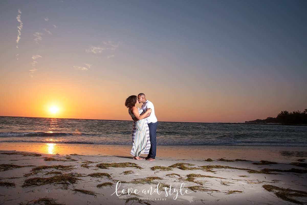 AMI Engagement Photography of couple kissing  on  Coquina Beach