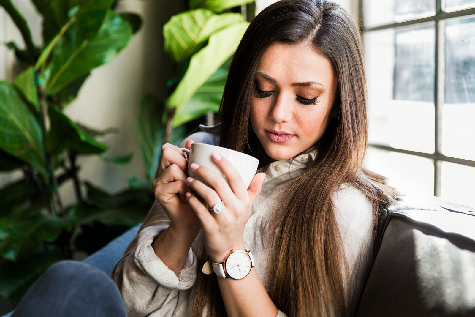 closeup of woman with coffee cup in coffee shop