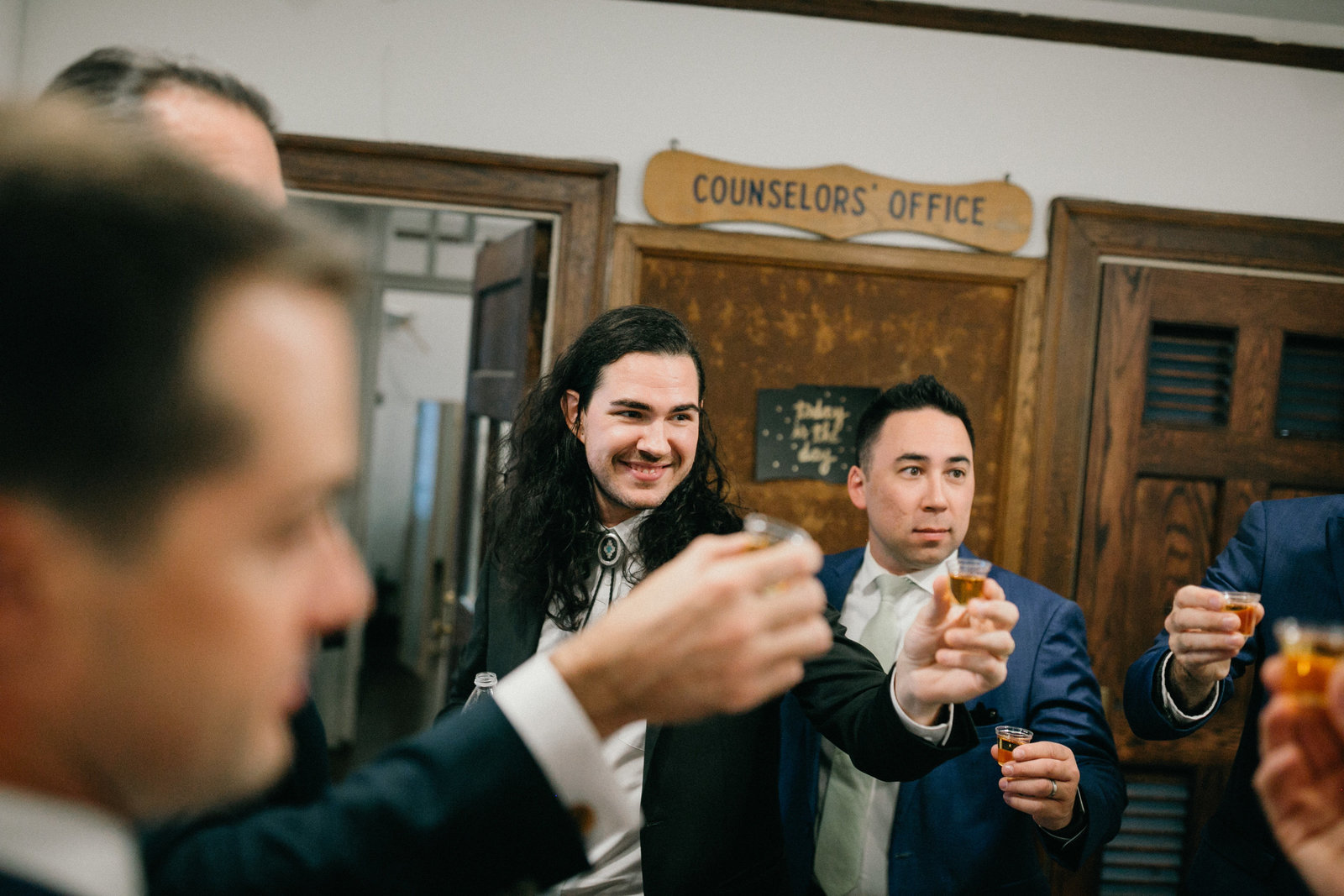 Let's hear it for the boys! Groom and his groomsmen take a shot before heading out for pictures.